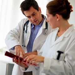 Medical professional assessing protocols